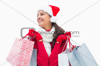 Beautiful festive woman holding shopping bags