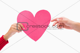 Woman passing man pink heart