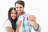 Happy young couple holding new house key
