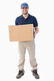 Happy delivery man holding cardboard box