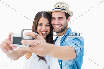 Happy hipster couple taking a selfie