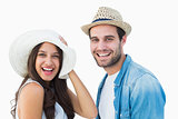 Happy hipster couple smiling at camera