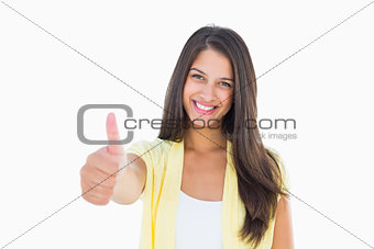 Happy casual woman showing thumbs up