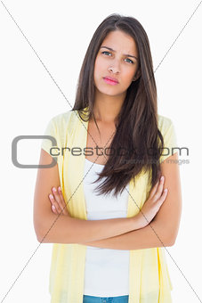 Frowning casual woman looking at camera