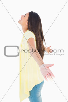 Happy casual woman spreading her arms