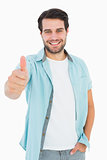 Happy casual man showing thumbs up
