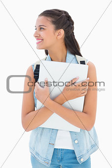 Pretty student holding her laptop