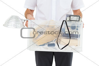 Businessman holding box of his things