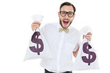 Geeky businessman holding money bags