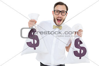 Geeky businessman holding money bags