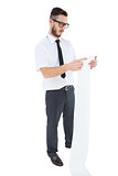 Geeky young businessman reading long receipt