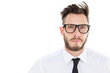 Geeky young businessman looking at camera