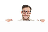 Geeky hipster showing poster smiling at camera