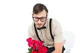 Geeky heartbroken hipster holding roses
