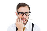 Geeky hipster biting on pencil