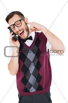 Geeky hipster talking on a retro cellphone