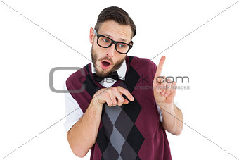 Geeky hipster in sweater vest pointing