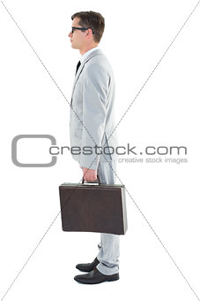 Geeky businessman holding his briefcase