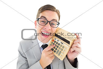 Geeky smiling businessman showing calculator