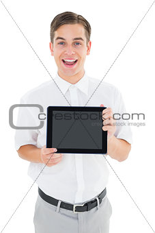 Geeky businessman showing his tablet pc