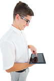 Geeky businessman using his tablet pc