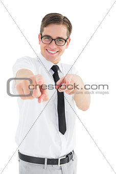 Geeky young businessman pointing at camera