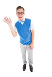 Geeky young hipster waving at camera