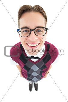 Smiling geeky hipster looking at camera