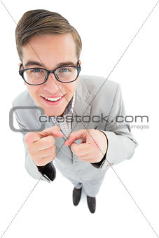 Geeky hipster smiling and pointing at camera