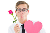Geeky hipster holding a red rose and heart card