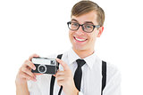 Geeky hipster holding a retro camera
