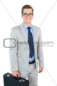 Geeky businessman smiling at camera