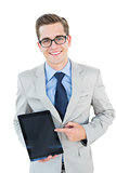 Geeky businessman pointing to tablet pc