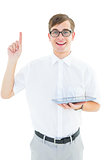 Geeky hipster holding tablet and pointing up