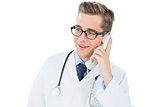 Handsome doctor talking on phone