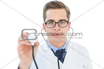 Handsome doctor listening with stethoscope
