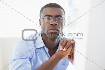 Thoughtful businessman looking at camera