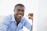 Happy businessman with electronic cigarette