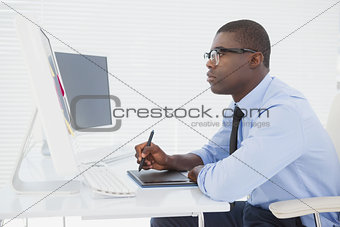 Focused businessman sitting at his desk working