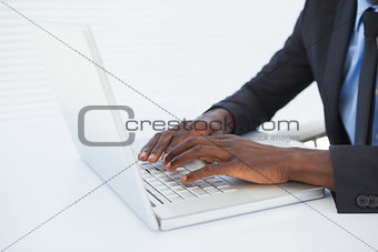 Businessman working at his desk on laptop