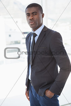 Handsome businessman frowning at camera