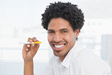Happy businessman holding electronic cigarette