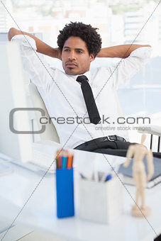 Serious businessman looking at computer