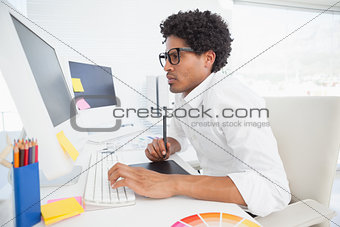 Hipster designer working at his desk