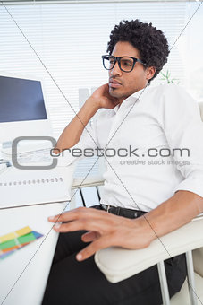Hipster businessman working at his desk
