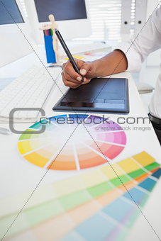 Designer working at desk using digitizer