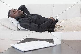 Casual man sleeping on his sofa