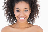 Pretty girl with afro hairstyle smiling at camera