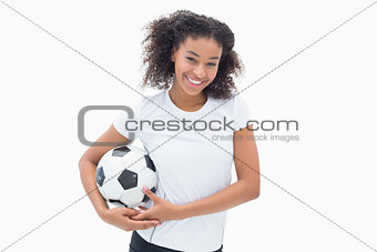 Pretty girl posing with her football