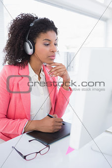 Casual graphic designer working at her desk